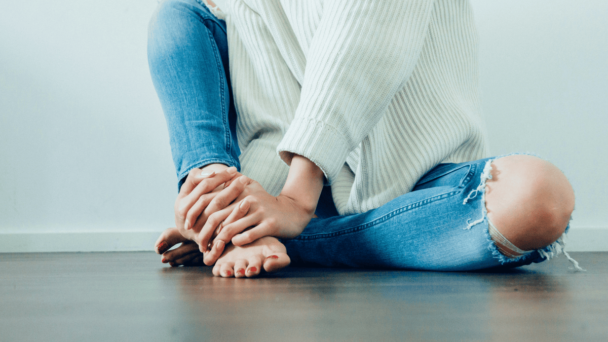 woman sitting with legs crossed
