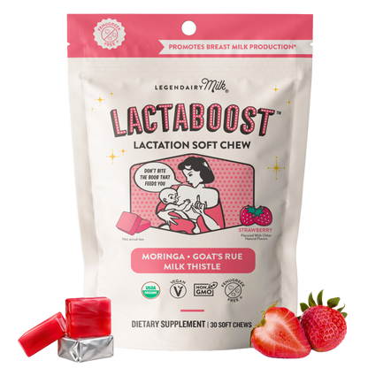 A stand-up pouch of Legendaairy Milk Lactaboost Lactation Soft Chew dietary supplement, shown on a white background with two red soft chews and sliced strawberries in front. The package is cream and pink with illustrated text and icons, and the flavor is Moringa + Goats Rue Milk Thistle.