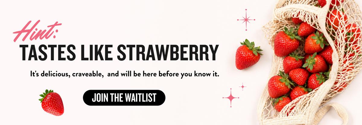 Promotional banner with the text 'Hint: TASTES LIKE STRAWBERRY' and 'It's delicious, craveable, and will be here before you know it.' alongside a black 'JOIN THE WAITLIST' button, a strawberry, and a mesh bag filled with strawberries on a white background.